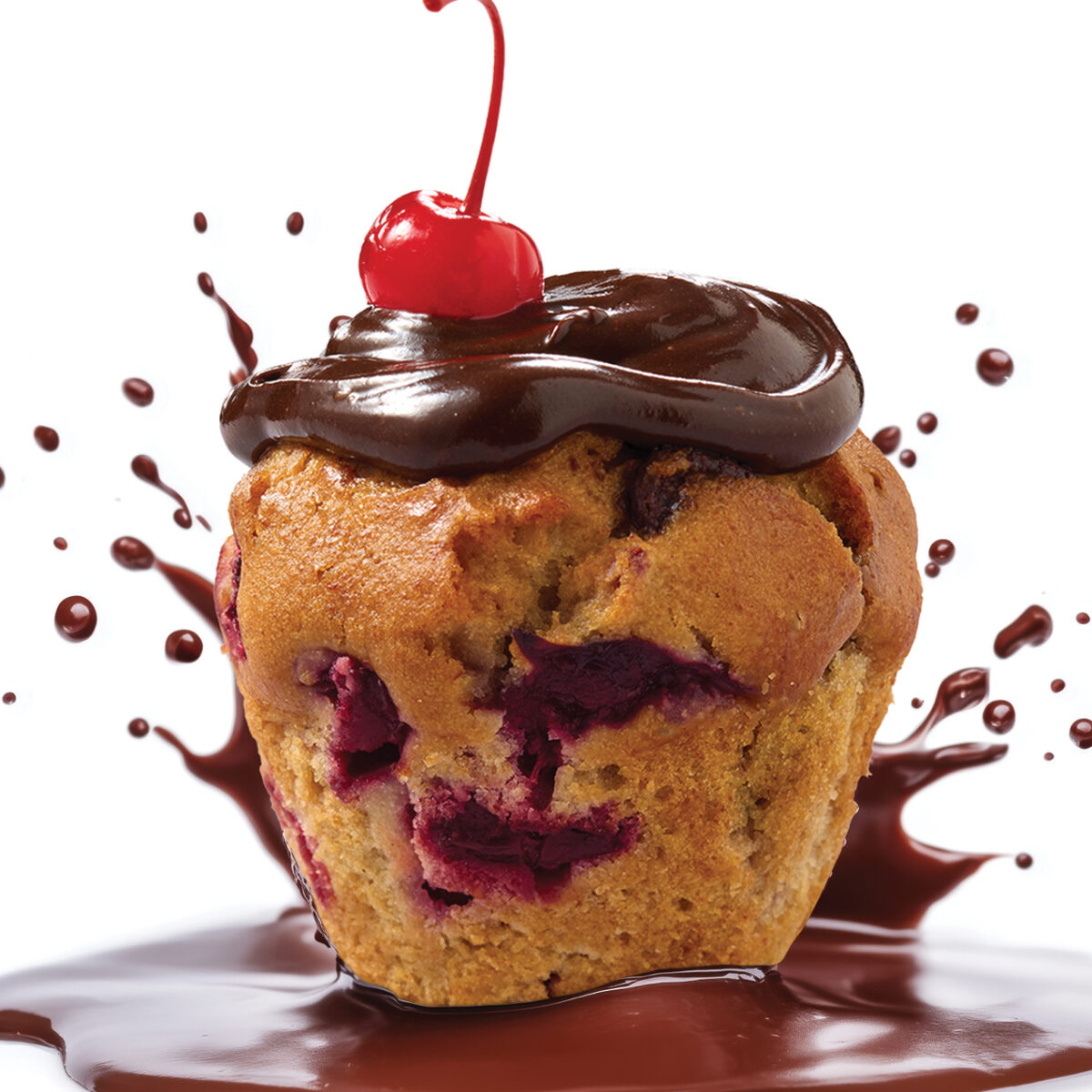 Cherry & Dark Chocolate Muffin topped with cream cheese icing and a cherry, available at Muffin Break Ormiston Town Centre